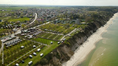 Aerial: Camping Area beside beautiful sandy beach and Baltic Sea in Chłapowo,Poland photo