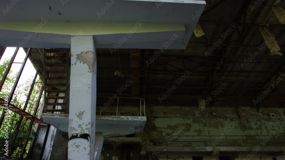 Tilt down shot of the diving boards and pool at Prypiat leisure complex. Long abandoned since the 1986 Chernobyl Nuclear Power Station Disaster. Tilt down shot of the diving boards and pool at Prypiat leisure complex. Long abandoned since the 1986 Chernobyl Nuclear Power Station Disaster.