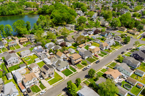 Aerial view of single family homes, a residential district Sayreville near pond in New Jersey USA