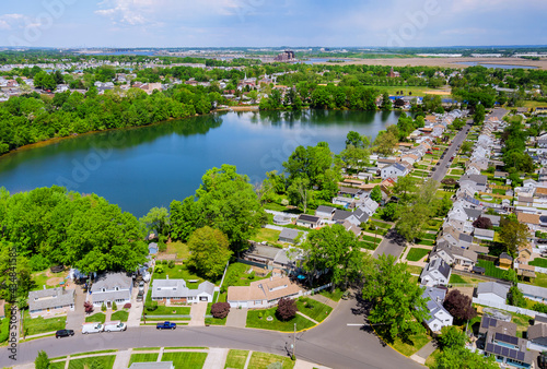 Aerial panorama view of the residential Sayreville town area of beautiful suburb of dwelling home near lake from a height in New Jersey US