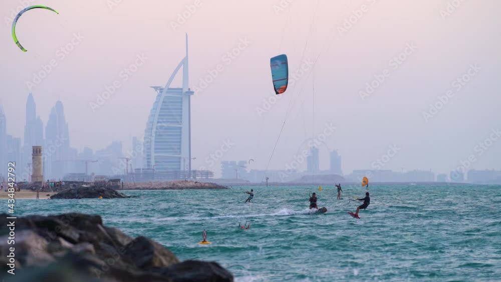 Kite Boarding On The Beautiful Dubai Beach With Downtown View On Background In Jumeirah, Dubai, United Arab Emirates. - Wide Shot