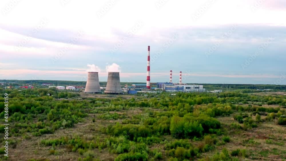 Combined heat and power plant at sunset. in the neighborhood of the city. aerial view . General plan. Combined heat and power plant at sunset. in the neighborhood of the city. aerial view . General plan.