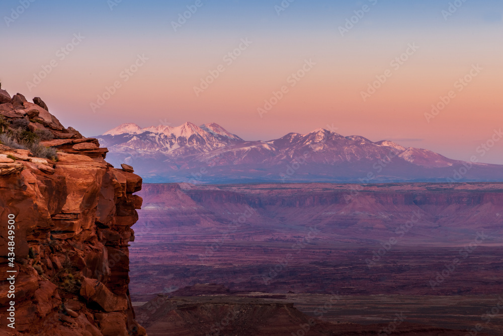 The La Sal Mountains seen in the distance from the Grand View Point Overlook in Canyonlands National Park at sunset