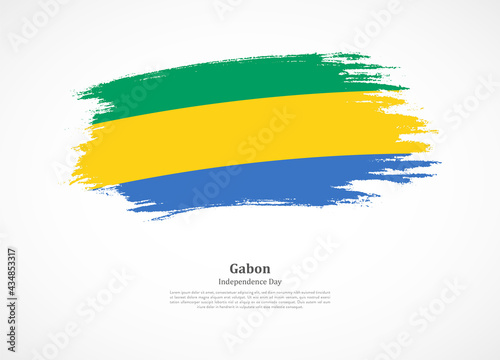 Happy independence day of Gabon with national flag on grunge texture