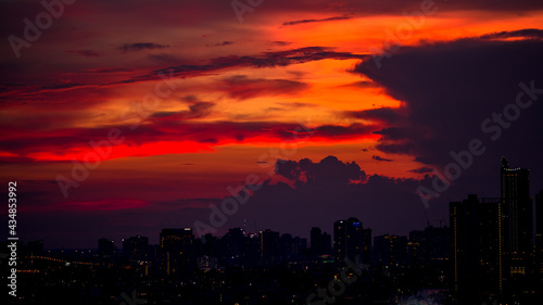 The high angle background of the city view with the secret light of the evening, blurring of night lights, showing the distribution of condominiums, dense homes in the capital community