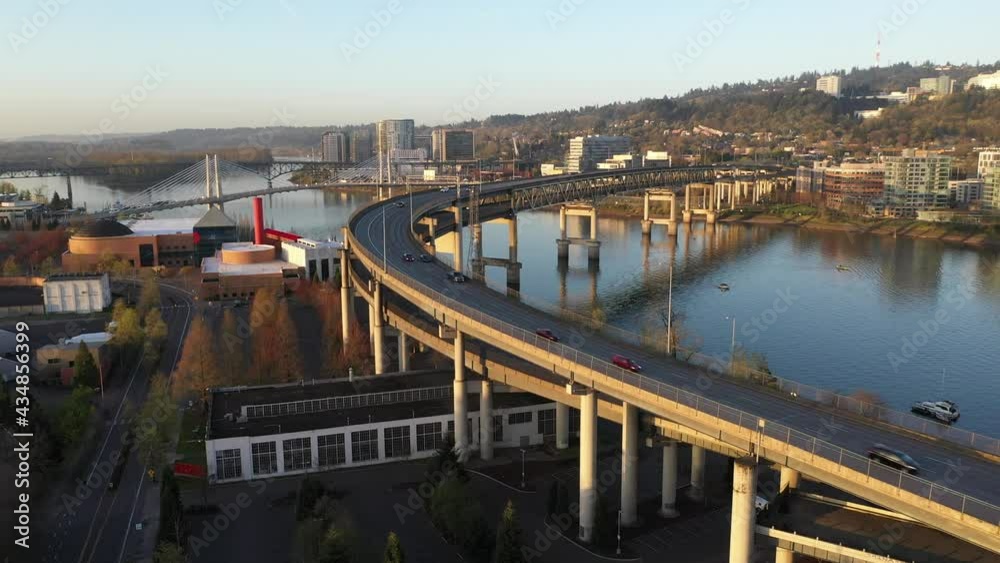 Cinematic 4K aerial drone video of downtown Portland South Waterfront, highways and bridges at the waterfront, over the Willamette River, Tom McCall Waterfront Park with cityscape in Oregon Cinematic 4K aerial drone video of downtown Portland South Waterfront, highways and bridges at the waterfront, over the Willamette River, Tom McCall Waterfront Park with cityscape in Oregon