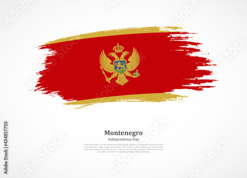 Happy independence day of Montenegro with national flag on grunge texture