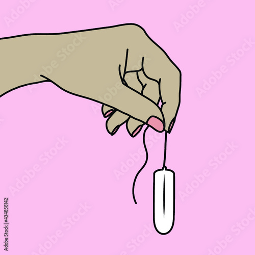 Woman's hand holding a tampon for disposal