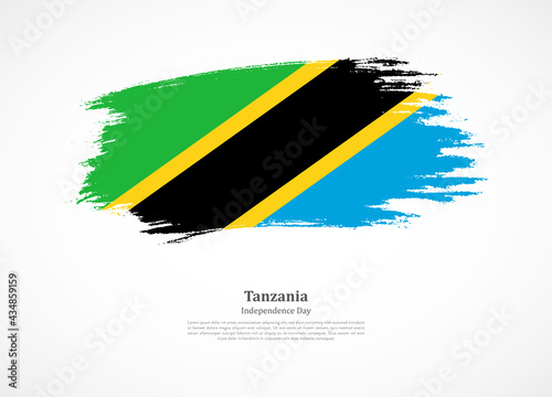 Happy independence day of Tanzania with national flag on grunge texture