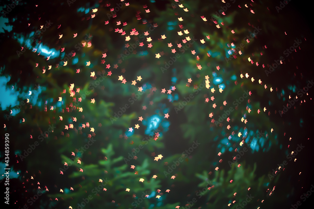 Blurred background with small stars on christmas tree. Abstract defocused shiny bright backdrop Blurred background with small stars on christmas tree. Abstract defocused shiny bright backdrop