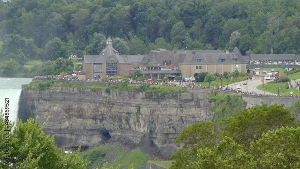 Niagara Falls tourists watching waterfall from platform, popular tourism sight