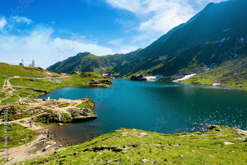 landscape of balea lake in fagaras mountains. wonderful summer nature scenery in the morning. popular travel destination of romania