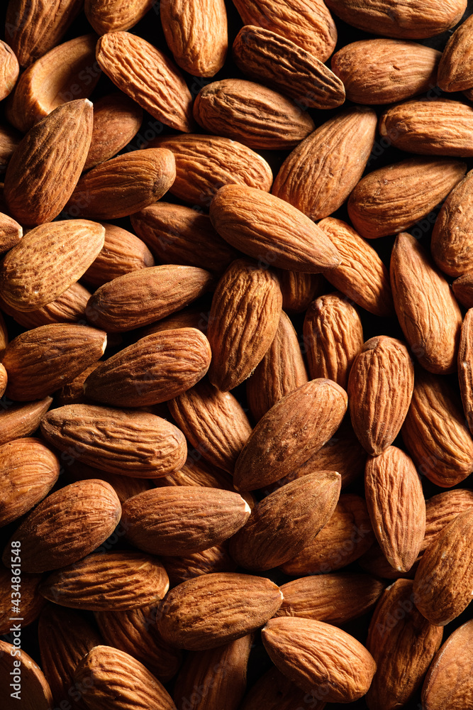 Fototapeta premium Food background of almond nuts close-up. Flat lay.