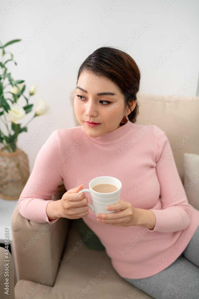 young attractive asian woman who drink tea
