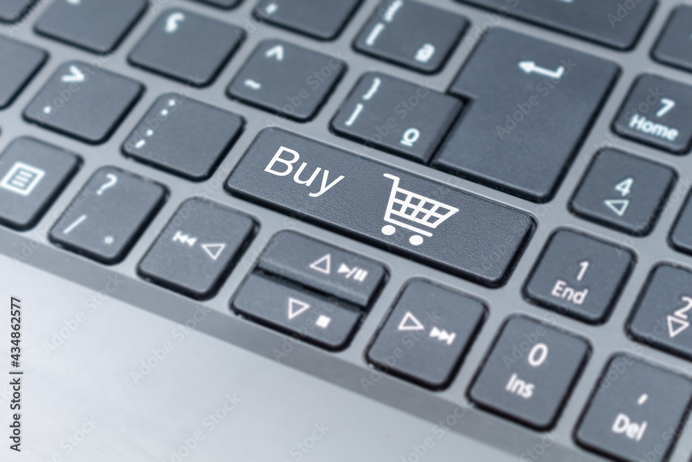 Online Shopping cart icon on keyboard key, e-commerce concept Online Shopping cart icon on keyboard key, e-commerce concept