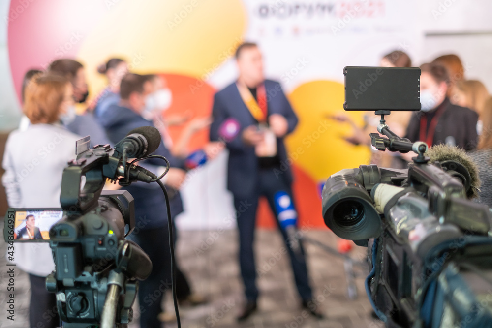 Camera recording video of interview with unrecognizable businessman Camera recording video of interview with unrecognizable businessman