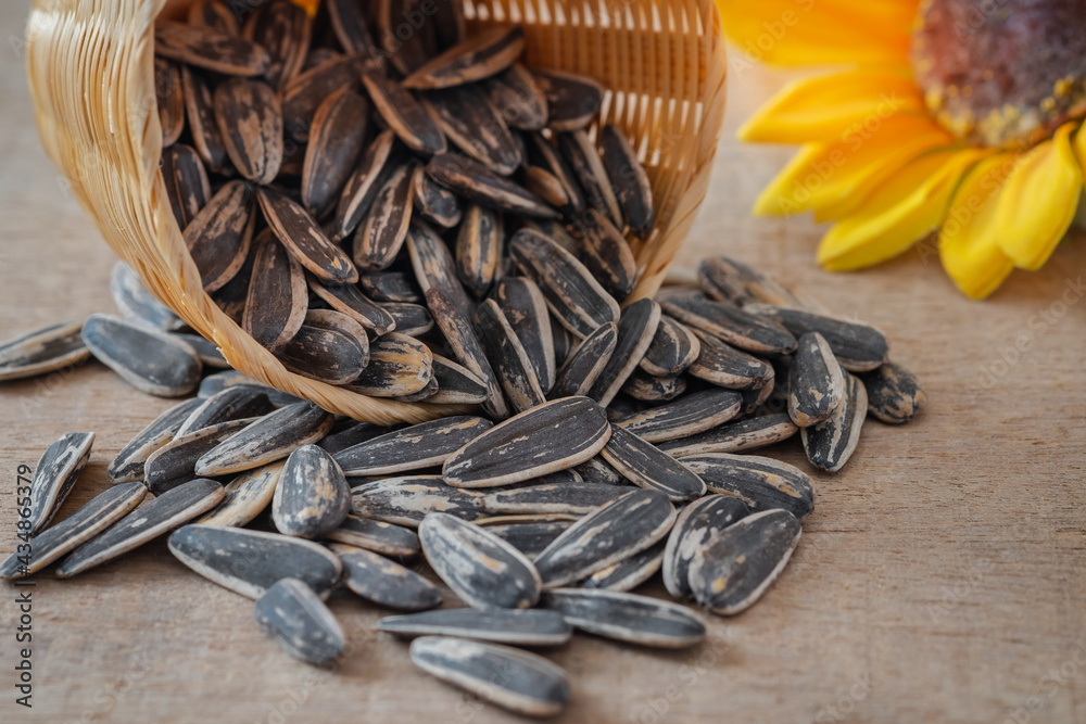 Pile of sunflower seeds on wooden table
