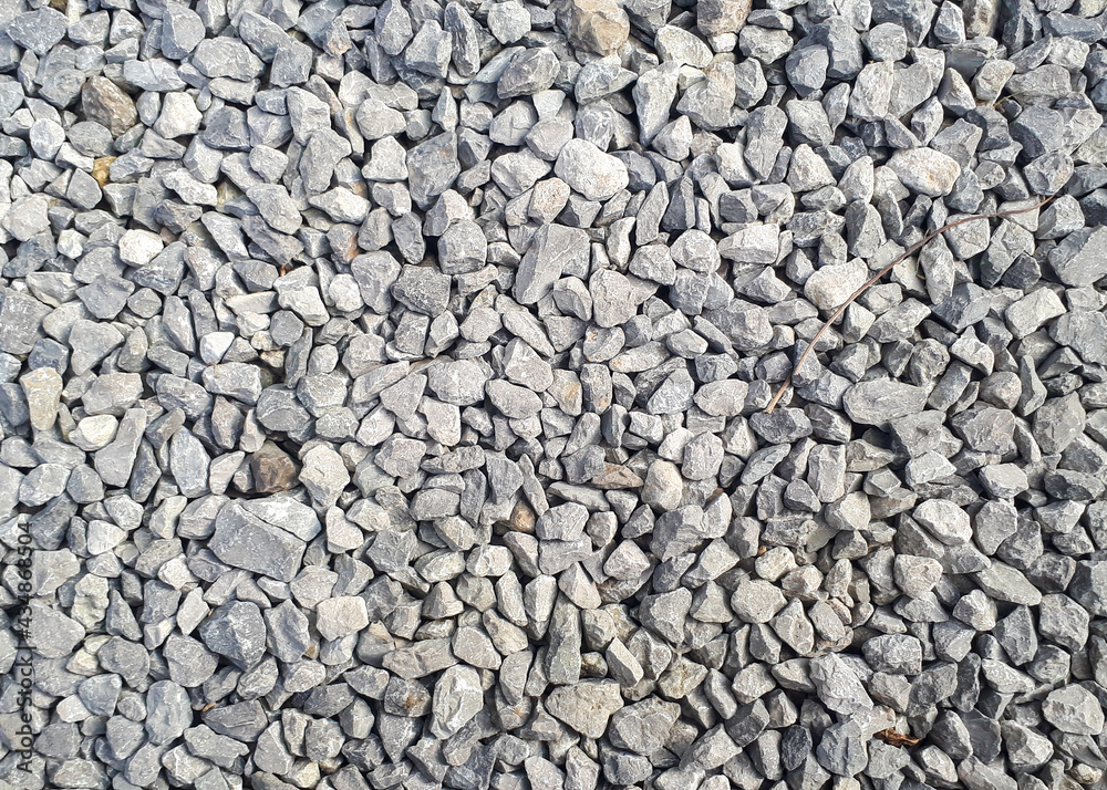 Gravel road texture. Small grey pebble patternt. Stone ground Gravel road texture. Small grey pebble patternt. Stone ground