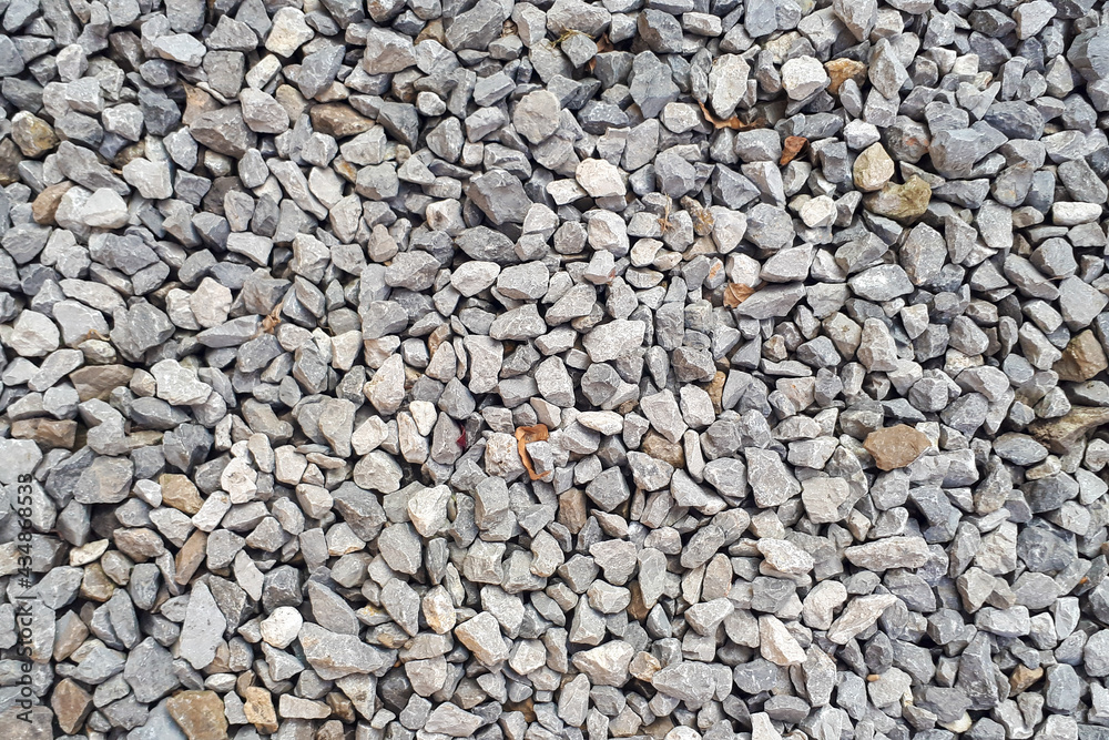 Gravel road texture. Small grey pebble patternt. Stone ground Gravel road texture. Small grey pebble patternt. Stone ground