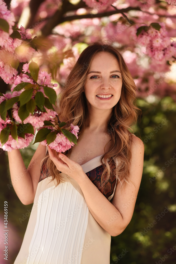 Beautiful young woman in the spring garden. Girl near sakura
Beautiful young woman in the spring garden. Girl near sakura