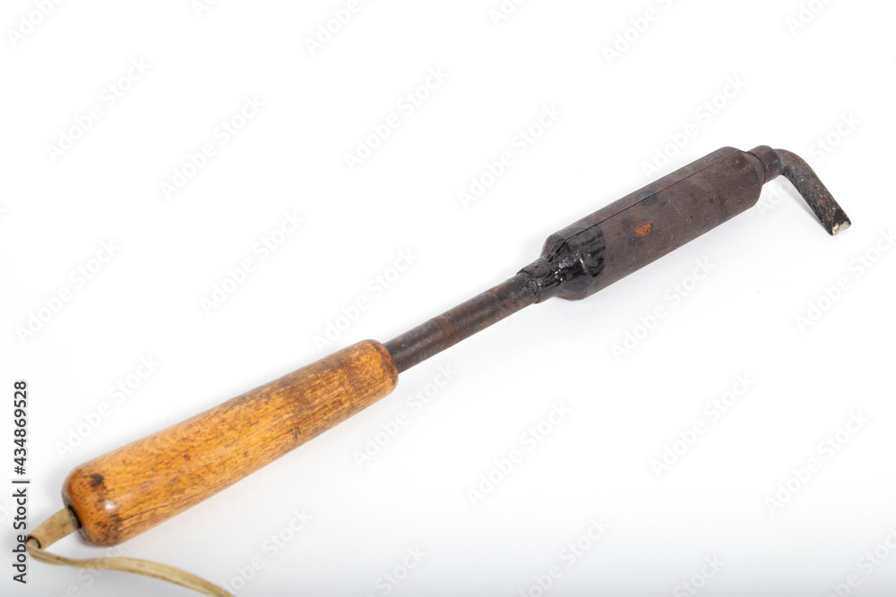 Old soldering iron with wooden handle for welding Old soldering iron with wooden handle for welding