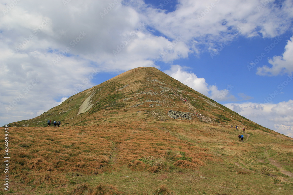 Mountain view, sports tourism, ascent and descent on a clear day, blue sky Mountain view, sports tourism, ascent and descent on a clear day, blue sky