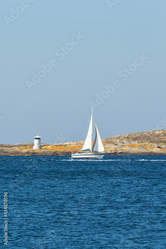 Sailboat in rocky archipelago