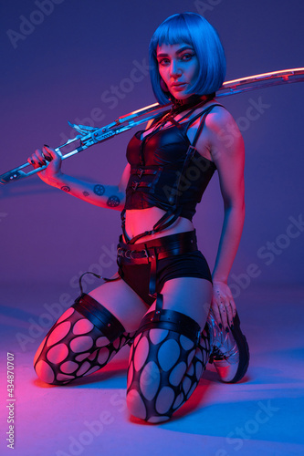 Seductive cyberpunk woman wielding glowing long sword