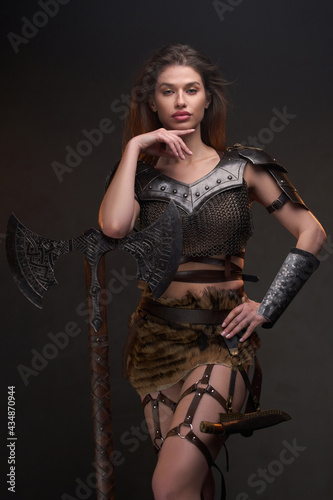 Barbaric woman viking with hand under her chin
