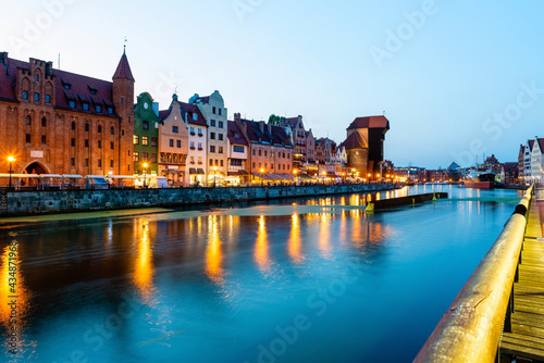 Gdansk night city riverside view. View on famous crane and facades of old medieval houses © lenaivanova2311