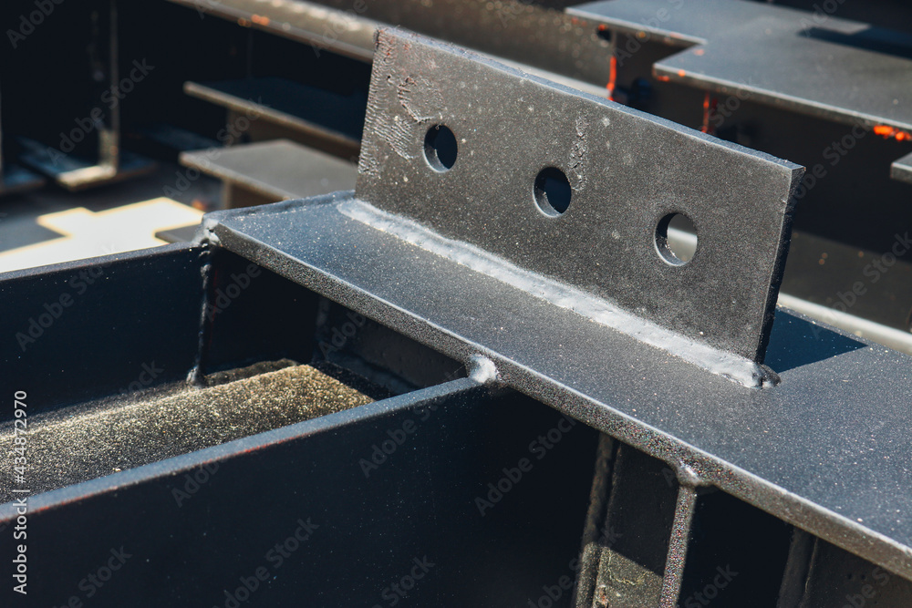 Steel beam fin plate for bolted connection joints. Stock Photo | Adobe Stock