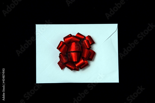 Envelope with a beautiful red gift bow