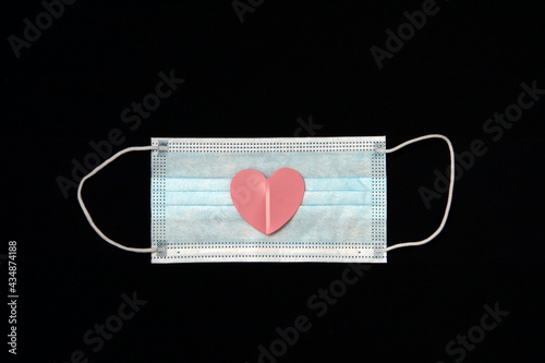 Disposable medical mask with hearts.