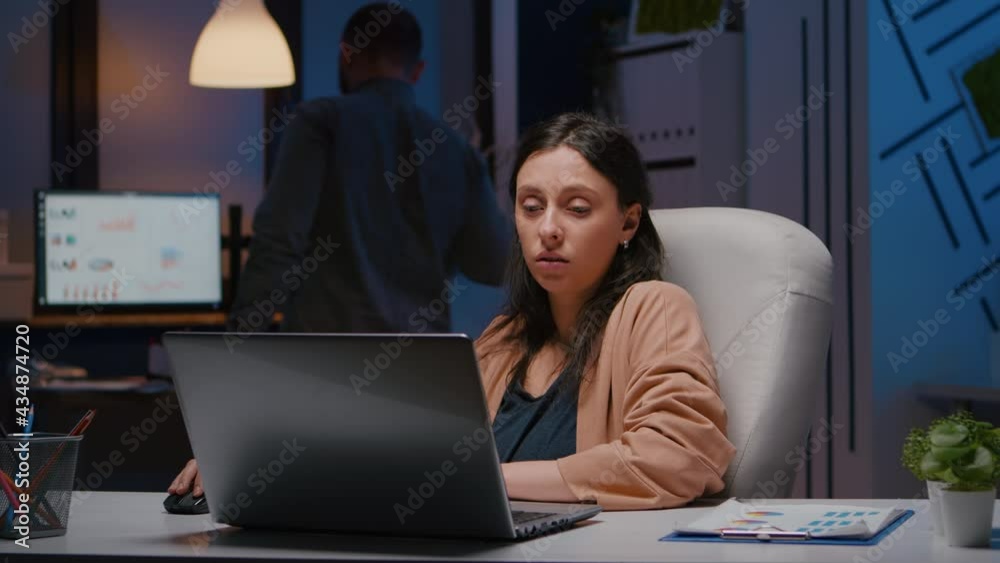 Workaholic entrepreneur woman sitting at desk table analysing financial graphics using laptop computer. Executive businesswoman planning marketing strategy working in startup business company office Workaholic entrepreneur woman sitting at desk table analysing financial graphics using laptop computer. Executive businesswoman planning marketing strategy working in startup business company office