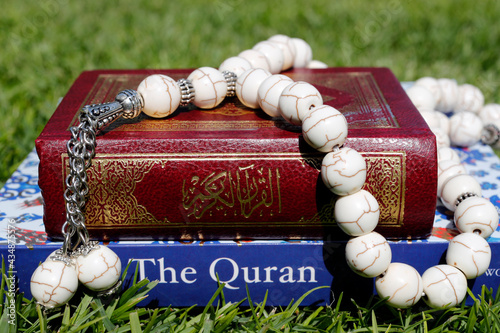 Prayer beads ( misbaha ) with Quran in arabic and english.   United Arab Emirates photo