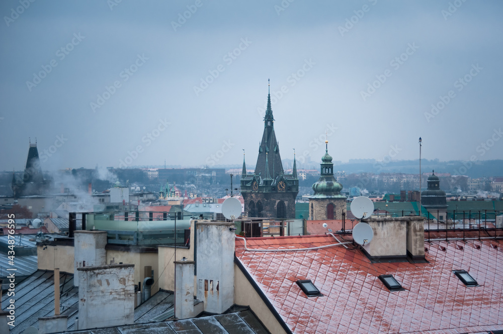 Fototapeta premium first snow on the rooftops of the center of Prague top view