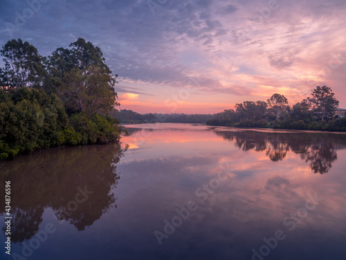 Fototapeta Naklejka Na Ścianę i Meble -  River Sunrise with Cloud Reflections