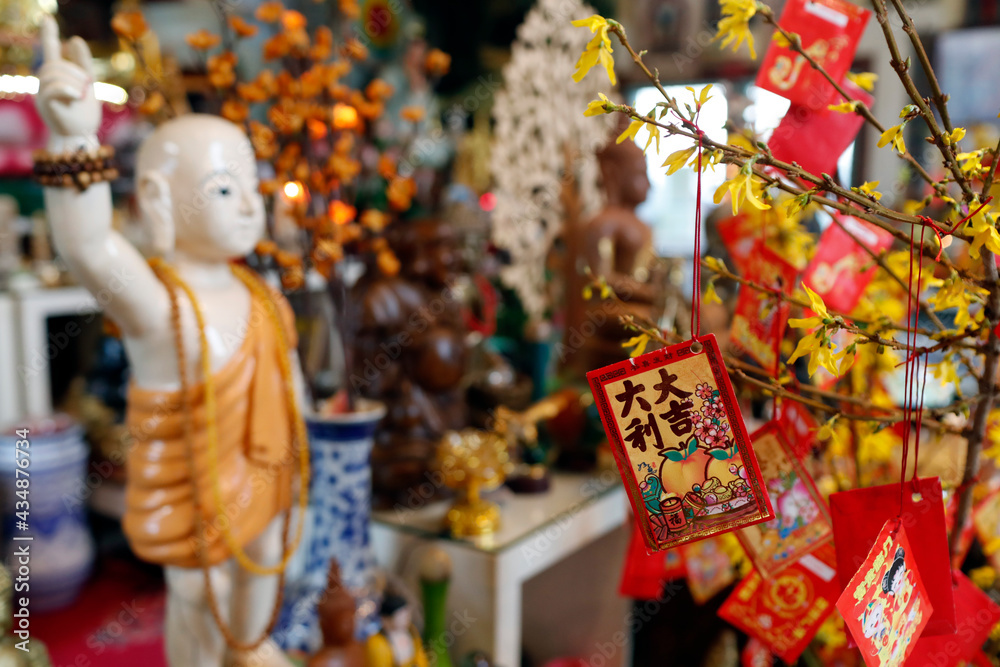 Red envelopes ( hongbao ) on yellow tree for Chinese and Vietnamese New Year. Red color is a symbol of good luck. Saint Pierre en Faucigny. France.