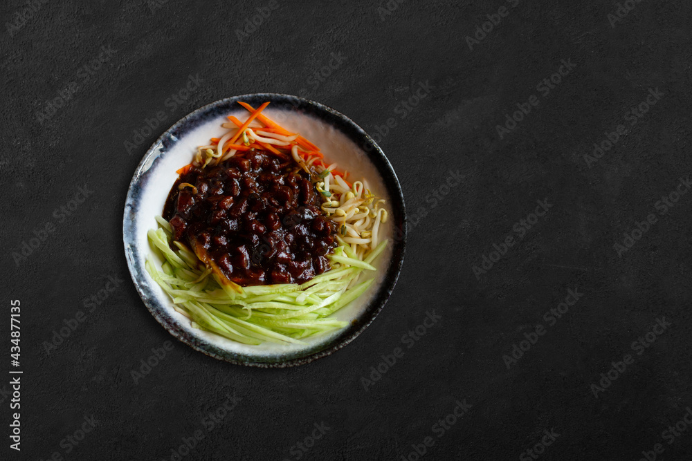 Homemade Chinese Beef Lo Mein with Carrots and Cabbage On Concrete Table. Homemade Chinese Beef Lo Mein with Carrots and Cabbage On Concrete Table.