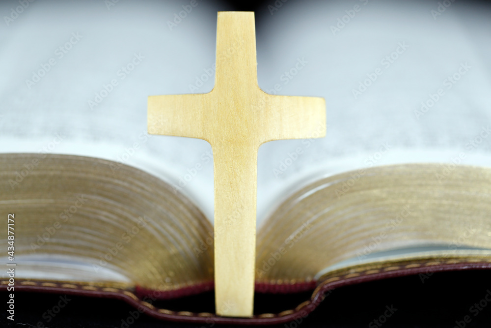 Open bible with christian cross. Faith and sprituality. France. Open bible with christian cross. Faith and sprituality. France.