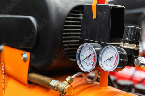 Fragment of a portable, gasoline compressor with pressure sensors. Close-up photo