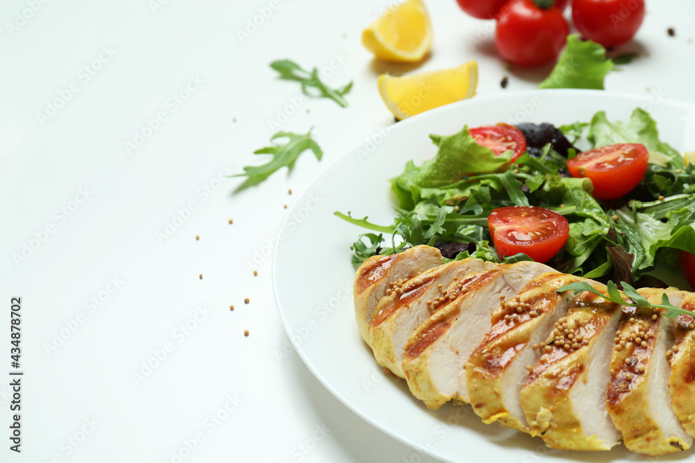 Concept of tasty eating with salad with grilled chicken on white background Concept of tasty eating with salad with grilled chicken on white background