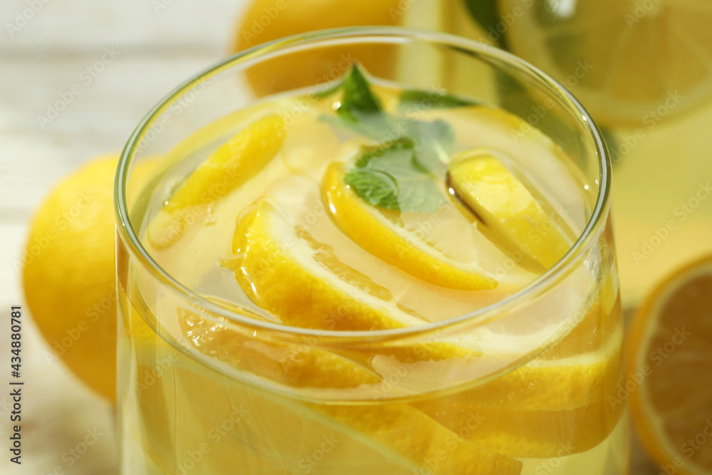 Glass of fresh lemonade with lemon slices, close up Glass of fresh lemonade with lemon slices, close up