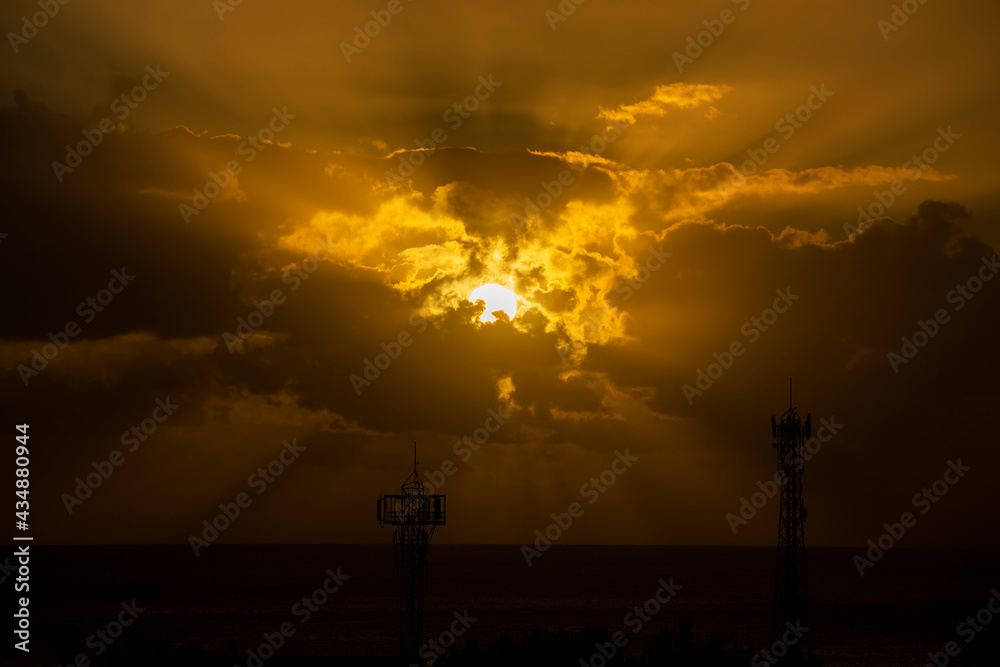 silhouette of the sun and clouds