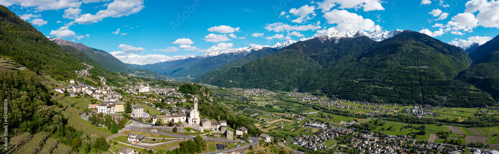 aerial view of the village of Poggiridenti and the church of San Fedele in Valtellina, Italy