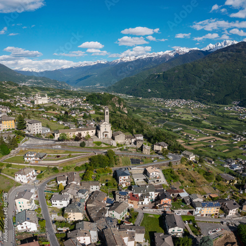 aerial view of the village of Poggiridenti and the church of San Fedele in Valtellina, Italy photo