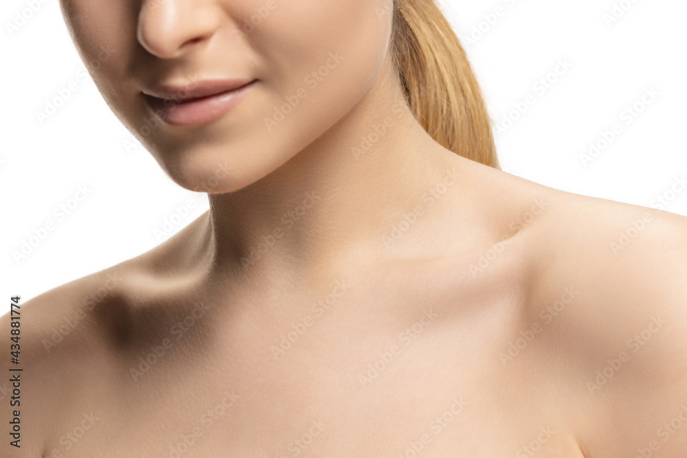 Close up portrait of young female fashion model isolated on white studio background. Beautiful caucasian woman with well-kept skin.