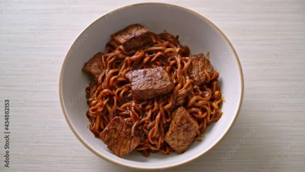 Jjapaguri or Chapaguri, Korean Black Beans Spicy Noodles with Beef - Korean food style Jjapaguri or Chapaguri, Korean Black Beans Spicy Noodles with Beef - Korean food style