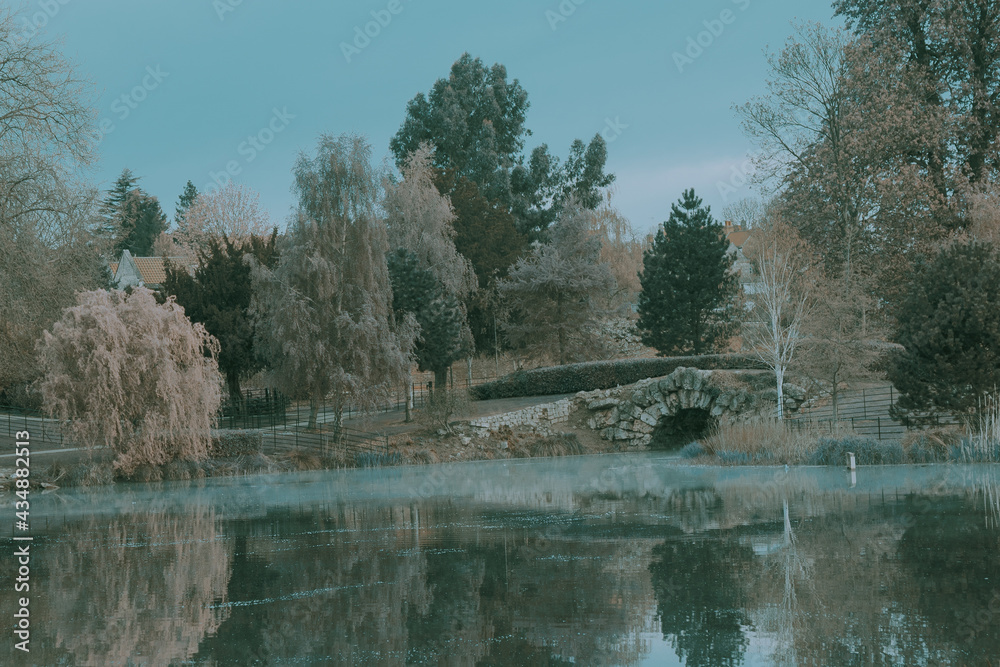 Early morning mist rising from a lazy pond