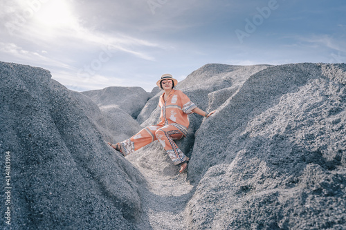person sitting on a rock